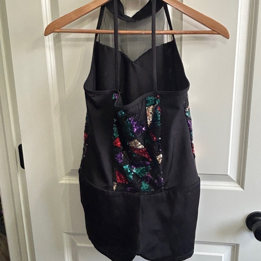 Like new XL girl’s 3 piece dance costume. Halter  leotard with  short & 2 skirts
